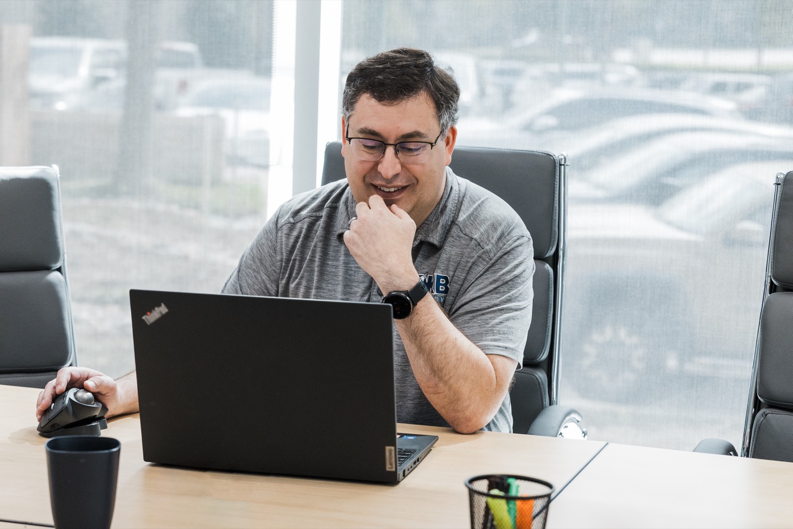 DKBinnovative engineer reviewing SEC Reg S-P compliance documentation on a laptop