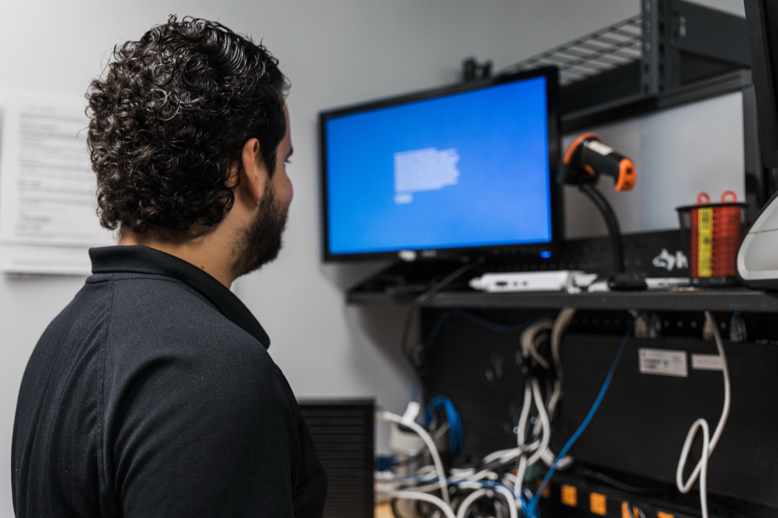 DKBinnovative engineer reviewing server and network infrastructure during a post-quantum readiness assessment